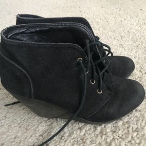 Black suede booties with gum sole